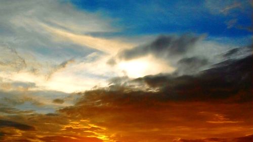 Low angle view of dramatic sky during sunset