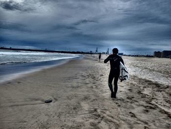 Woman standing on beach