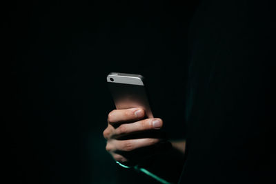 Close-up of man using mobile phone