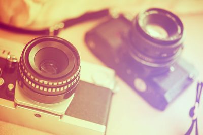 High angle view of cameras on table