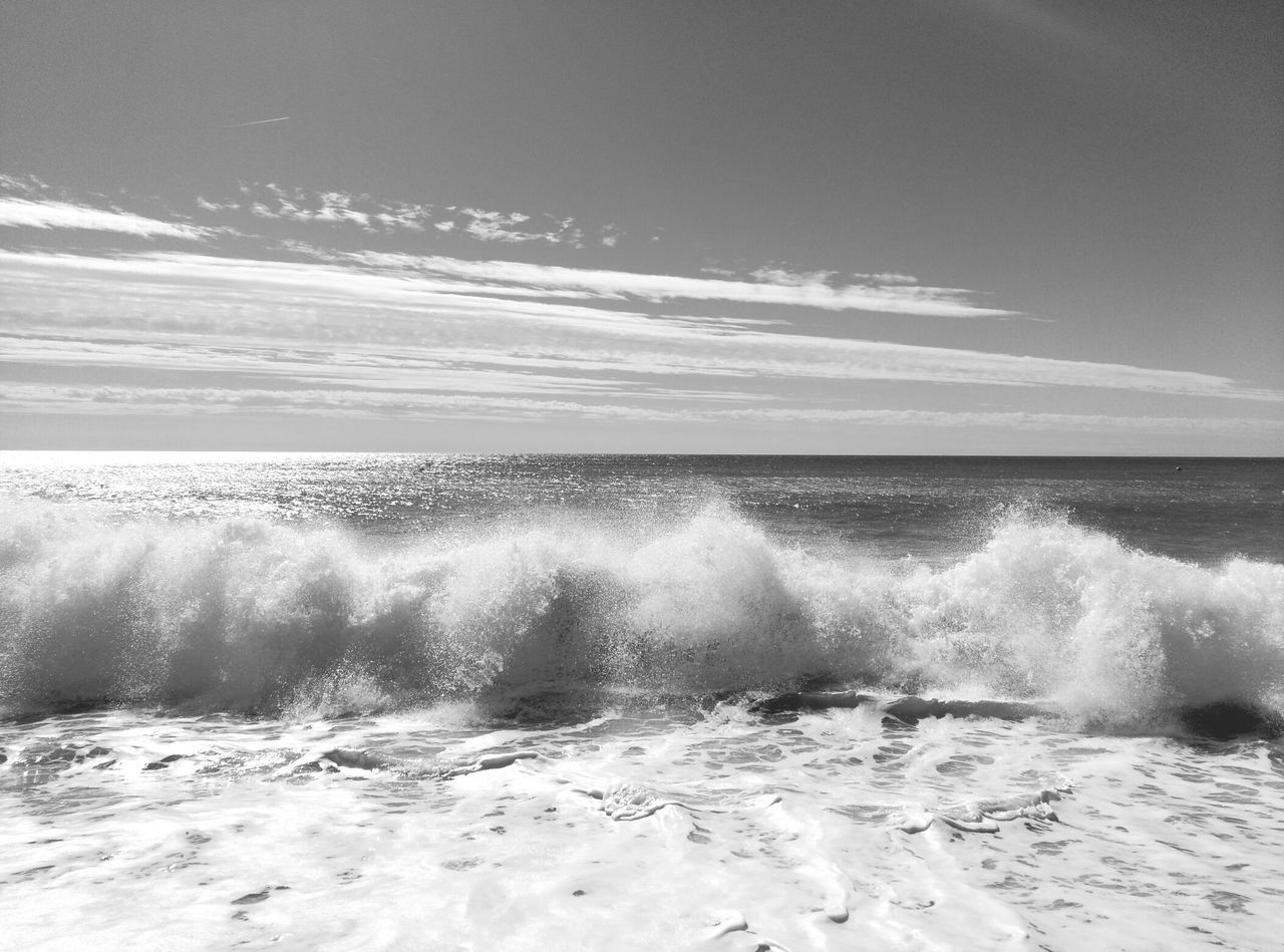 sea, water, horizon over water, wave, surf, beach, motion, splashing, shore, scenics, sky, beauty in nature, nature, sand, vacations, surfboard, power in nature, leisure activity, surfing