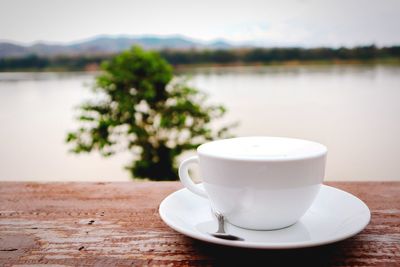 Close-up of coffee cup on table