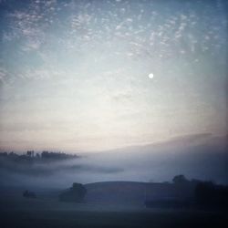 Scenic view of silhouette landscape against sky