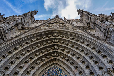 Low angle view of ornate building against sky