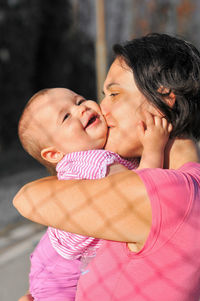 Close-up of mother and daughter