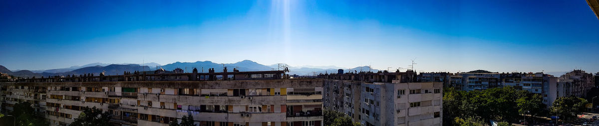 Buildings in city against sky