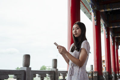 Young woman using mobile phone