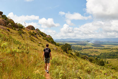 Young man walking in the mountains in swaziland