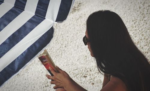 High angle view of woman using mobile phone