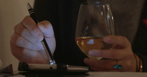 Close-up of hand holding wine glass