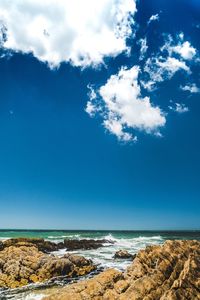 Scenic view of sea against blue sky