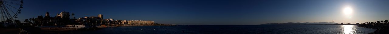 Panoramic view of buildings against sky during sunset