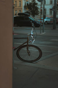 Bicycle on sidewalk by street