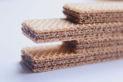 High angle view of bread on table against white background