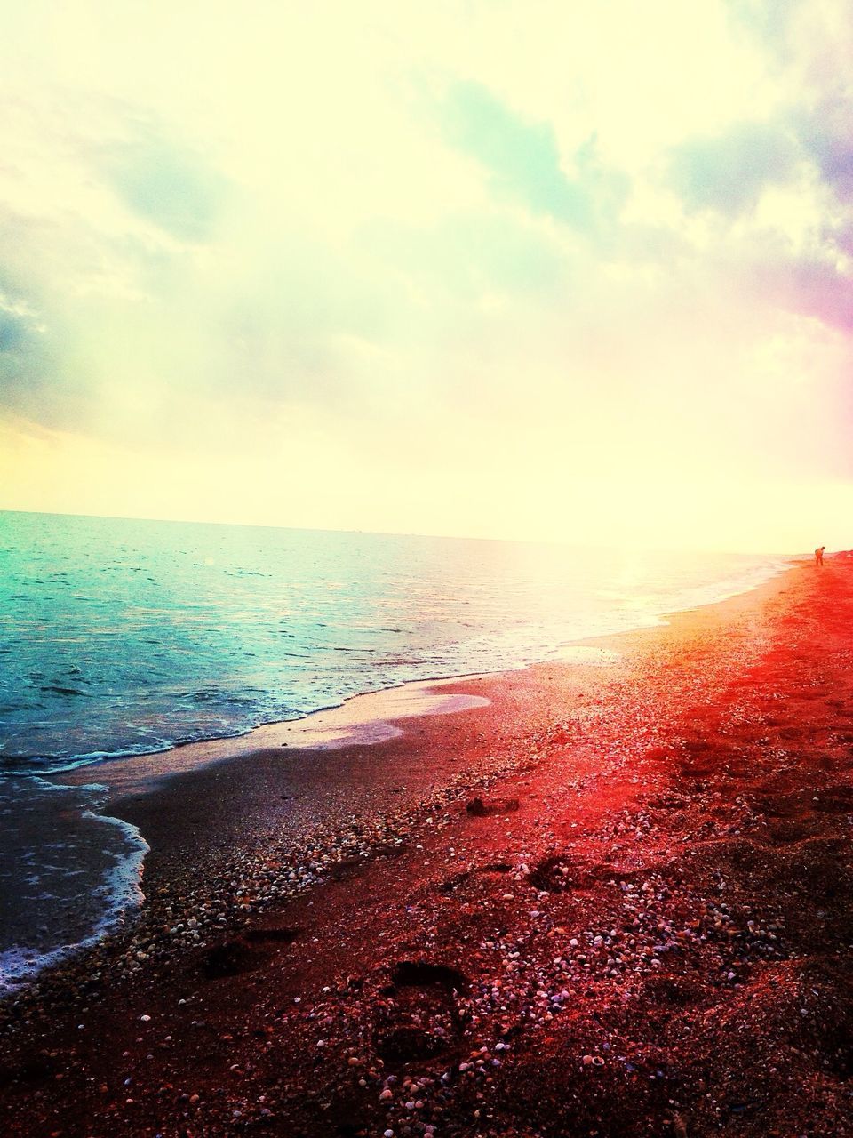 sea, water, horizon over water, beach, sky, tranquil scene, scenics, beauty in nature, tranquility, shore, nature, cloud - sky, idyllic, sand, coastline, sunset, remote, cloud, outdoors, cloudy