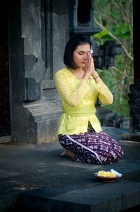 Woman sitting outdoors