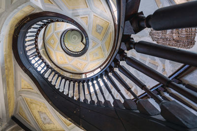 Low angle view of spiral staircase in building