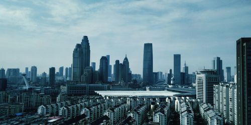 Modern buildings in city against sky