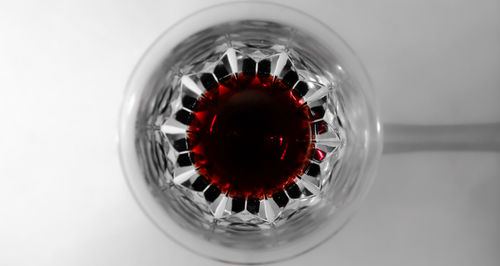 Close-up of red fruit over white background