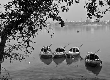 Boats moored in lake