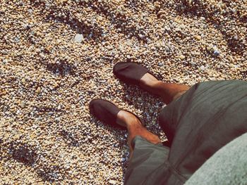 Low section of woman standing on tiled floor