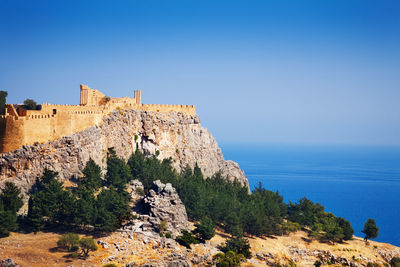 Scenic view of fort against clear blue sky