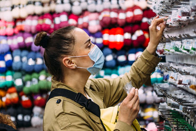 Portrait of woman looking at store