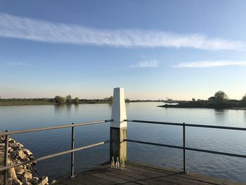 Pier over lake against sky