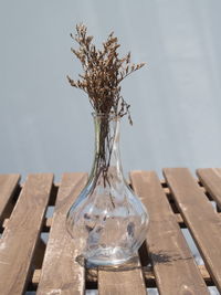 Close-up of empty glass bottle on table