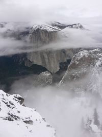 Scenic view of snow covered mountains against sky