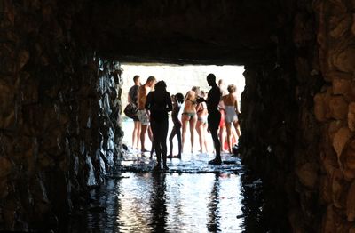 Group of people standing in water