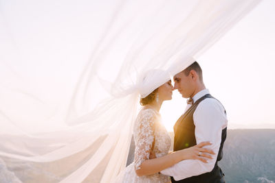 Affectionate couple standing outdoors