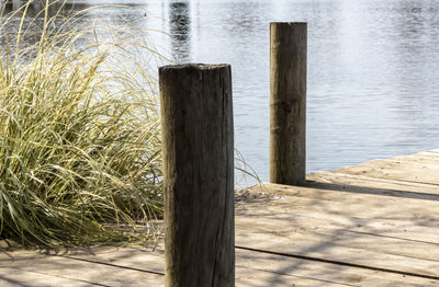 Close-up of wooden post in lake