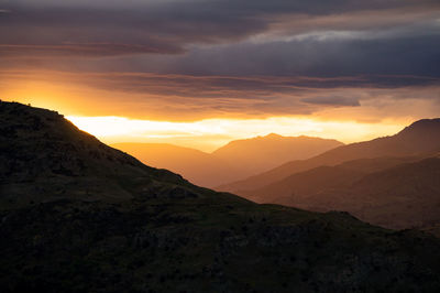 Scenic view of mountains against sky during sunset