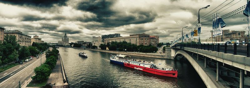 Panoramic view of city against cloudy sky