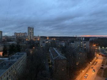 High angle view of illuminated city buildings against sky