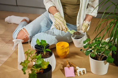 Midsection of woman preparing food on table
