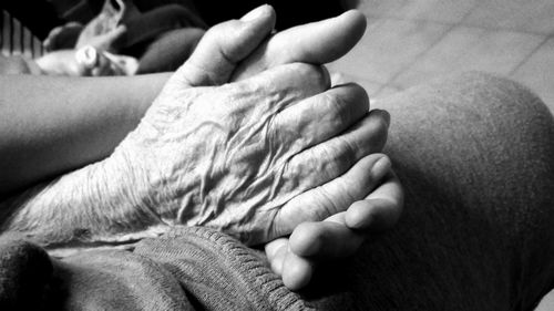 Cropped image of man holding baby