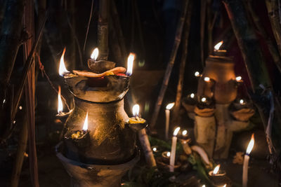 Illuminated candles in temple