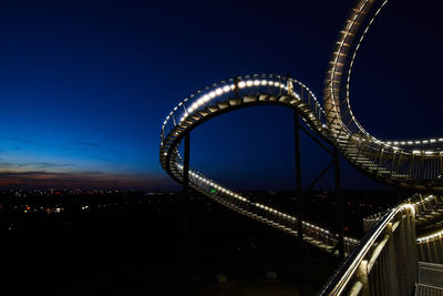 Illuminated ferris wheel at night