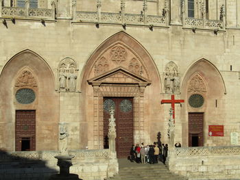 People walking in front of cathedral