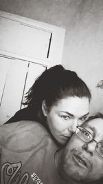 Portrait of young man lying down at home