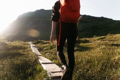 Rear view of man standing on field