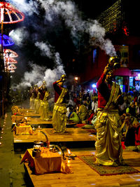 Statue in illuminated temple at night