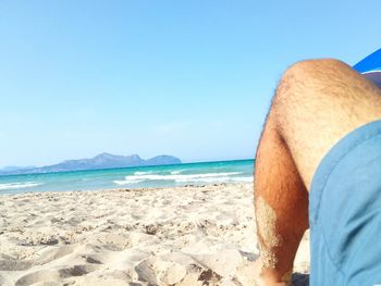 Scenic view of beach against clear sky