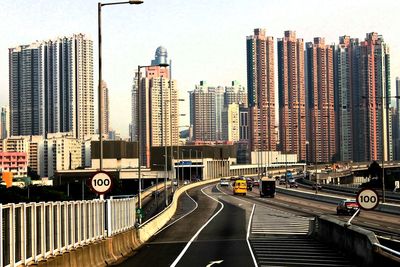 View of city street and buildings against sky