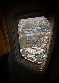 Aerial view of city seen through airplane window