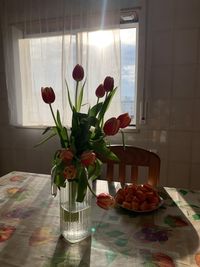 Flower vase on table at home