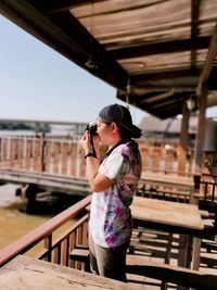 Full length of woman photographing