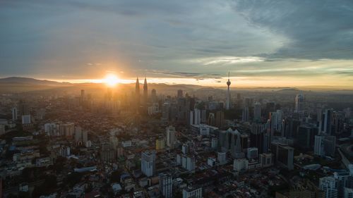 Aerial view of city during sunset